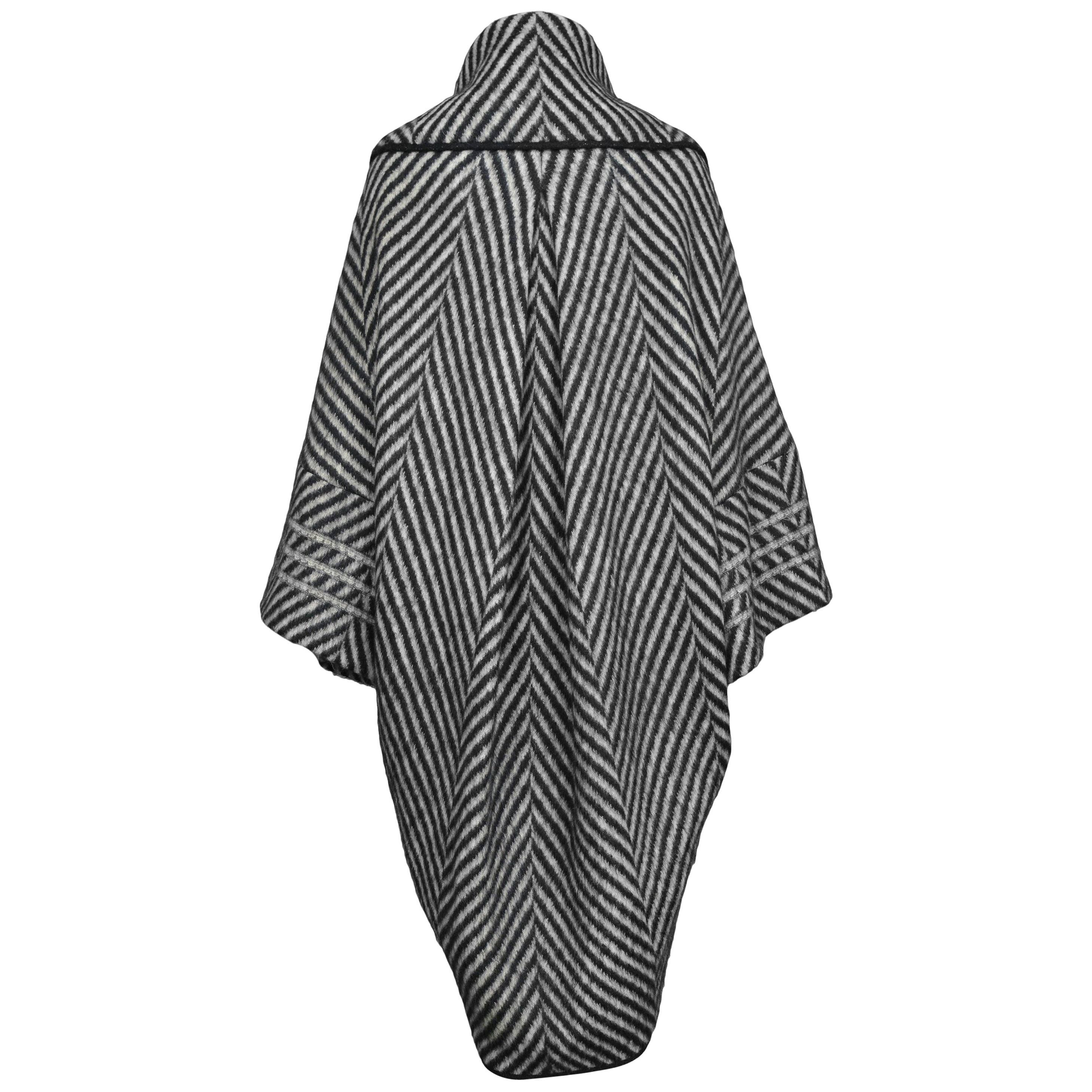 Stunning John Galliano Black & White Alpaca Cocoon Coat. The coat features soft luxurious fabric, black edges, shawl collar and cocoon fit. Front button closure. 