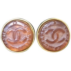 Vintage CHANEL brown candy earrings with  gold tone frame and engraved logo.