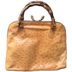 Gucci Retro orange brown color ostrich leather bolide bag with bamboo handles.