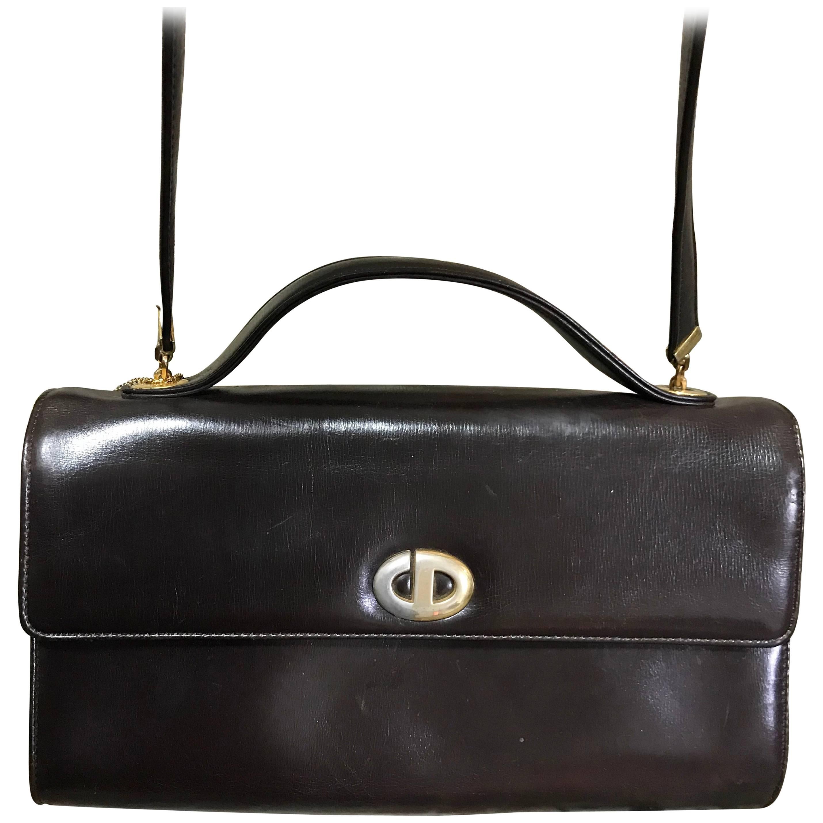 Vintage Christian Dior dark brown leather shoulder bag with CD motif and strap. For Sale