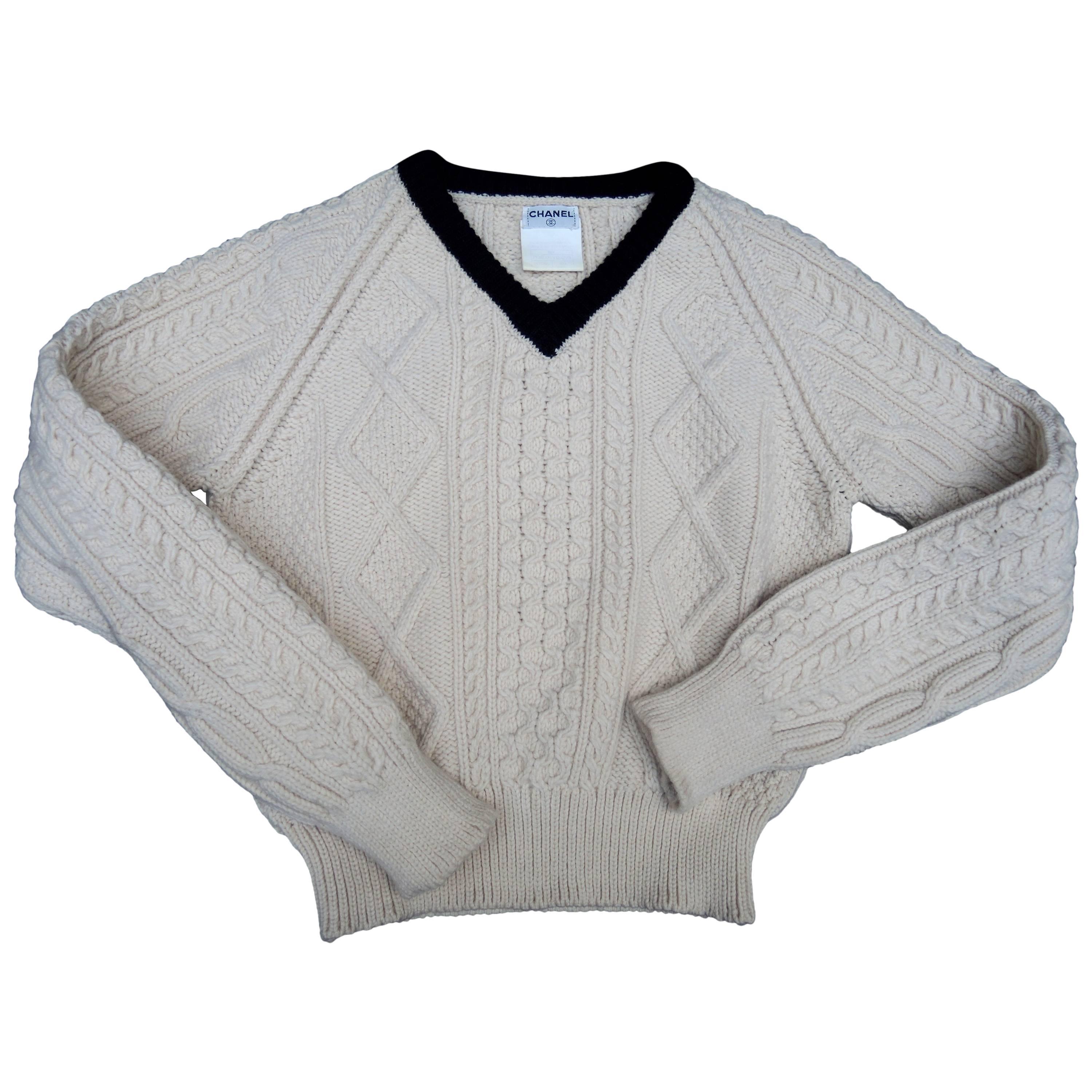 A Chanel handknit V neck wool sweater from 1999. The wool is soft and the design is an updated figure flattering rendition of the Classic English fishermans sweater.
marked as a size 40, but it is a perfect fit for a 38.