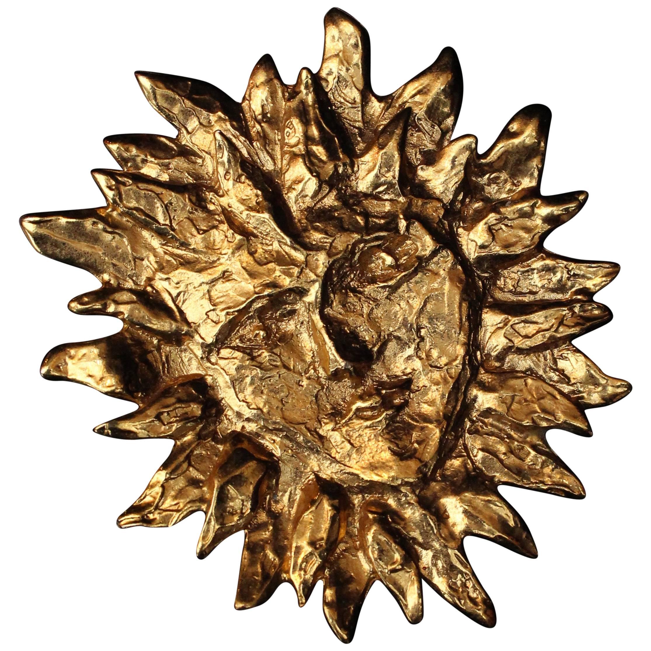 Yves Saint Laurent gilded metal sun-shaped brooch, 1980s 