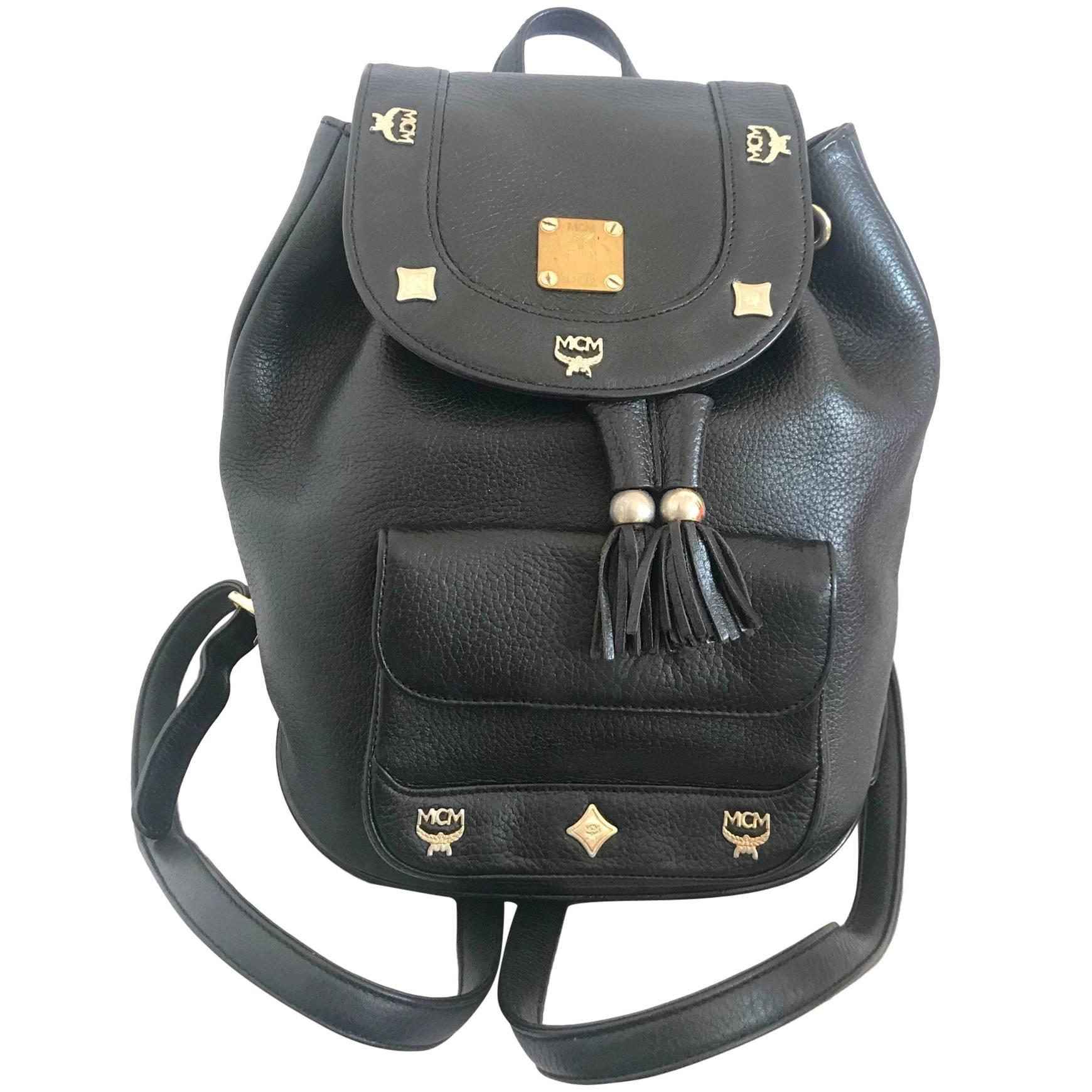 Vintage MCM black backpack with golden studded motifs, by Michael Cromer For Sale