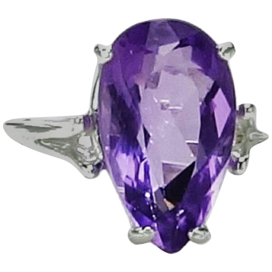 Custom made, lovely Lilac long pear Amethyst set in Sterling Silver ring.  This unique Amethyst is 4.81ct and 15x9mm and is set in a basket style setting.  This sweet gemstone comes from our favorite supplier up in the mountains outskde of Rio de