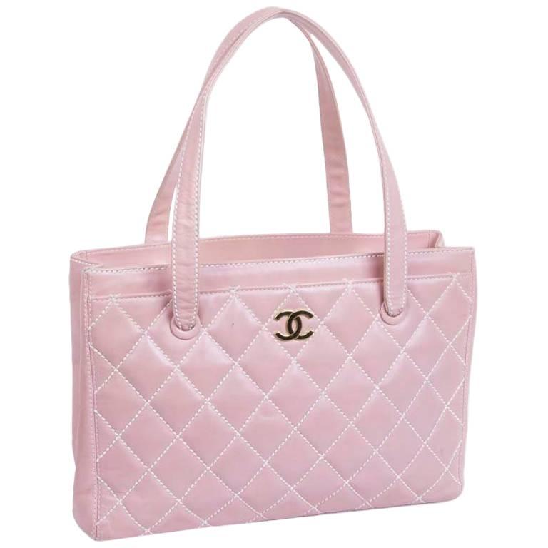 CHANEL Bag in Pink Quilted Smooth Leather with a White Stitching at
