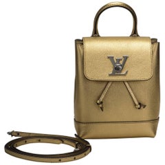 Vuitton - Mini sac à dos Lockme, doré, vente épuisée, état neuf