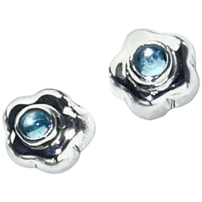 Silver Flowers with Blue Topaz Centers Stud Earrings