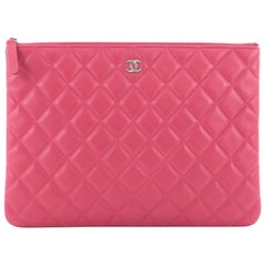 Chanel O Case Clutch Quilted Lambskin Medium