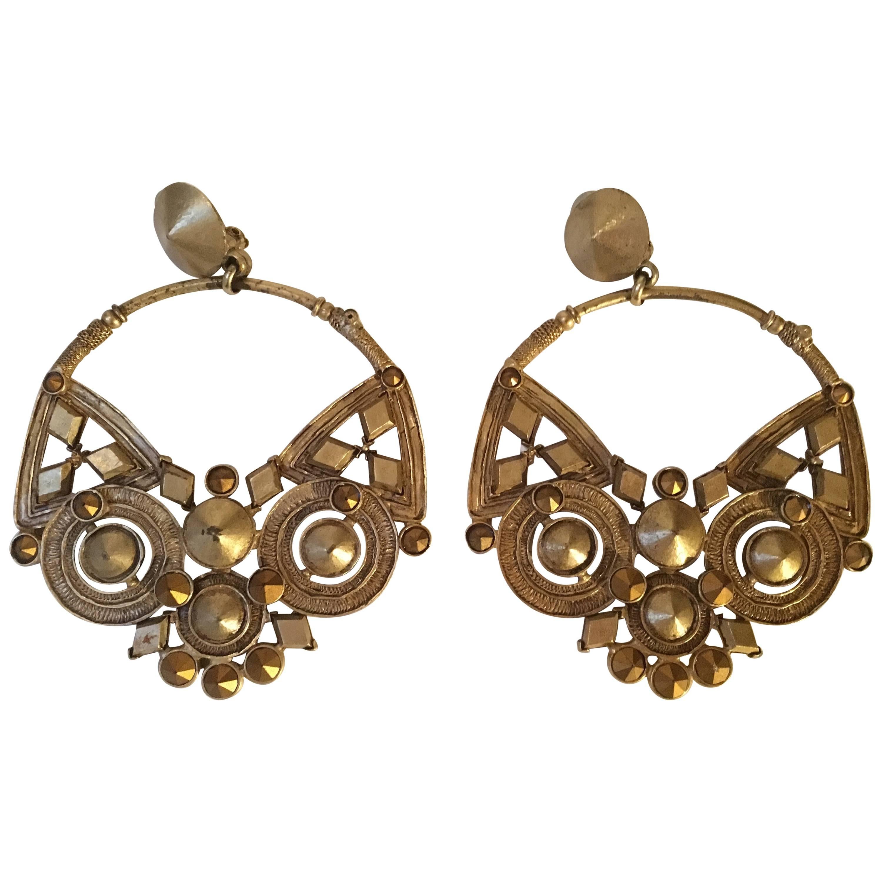 Jean Paul Gaultier large pair of earrings , mat gold plated on bronze . For Sale