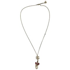 CHANEL Necklace in Gilded Metal and Pendant in pink and transparent Molten Glass
