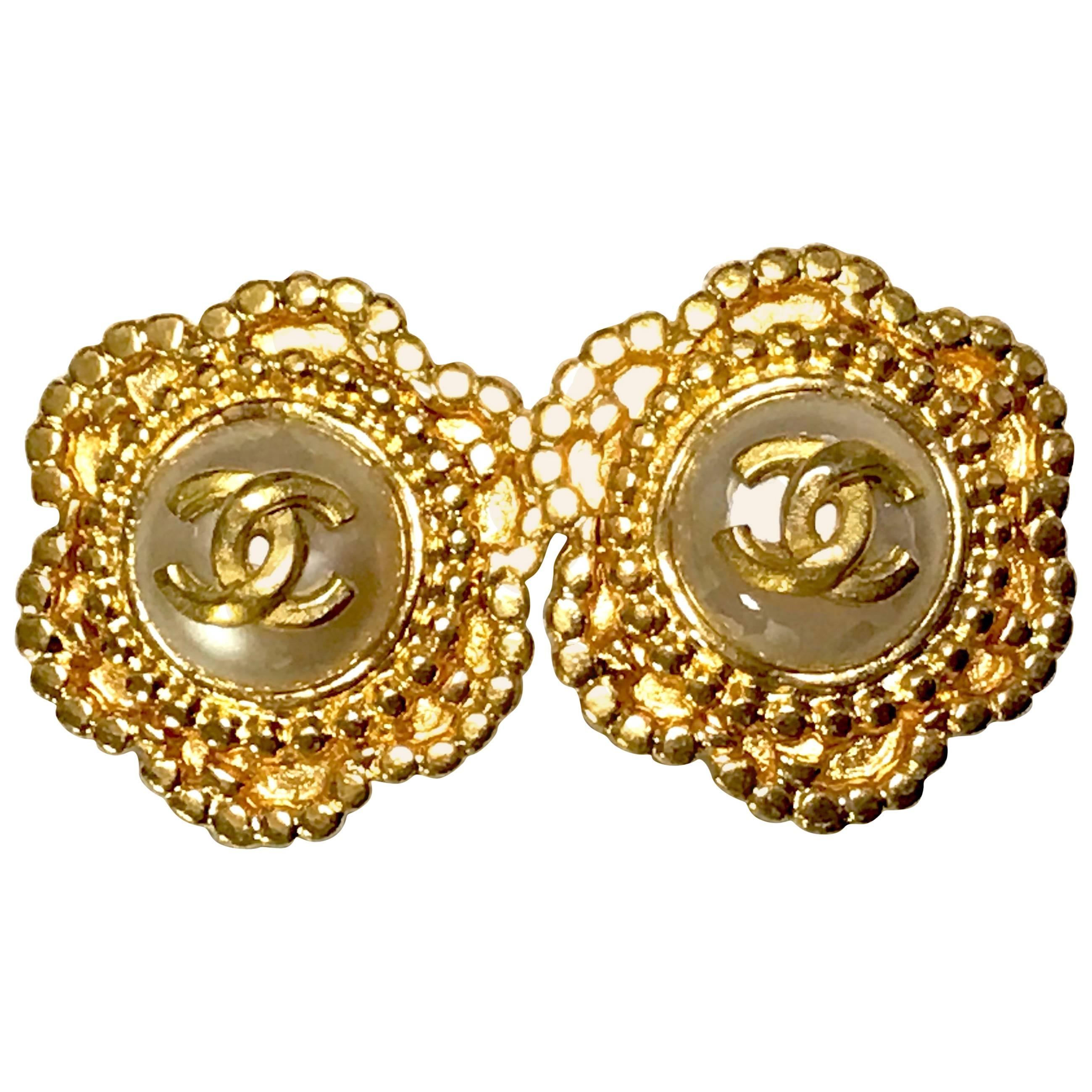 Vintage CHANEL golden six petal flower design earrings. CC mark and faux pearl. 