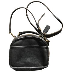 Vintage COACH genuine black leather oval lunchbox shape shoulder bag. USA made.