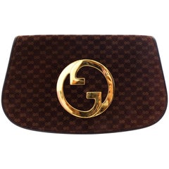 1972 Gucci Blondie Gold Emblem Monogram Clutch