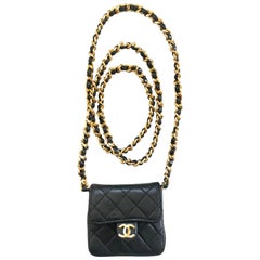 Retro Chanel black mini 2.55 bag/necklace with long chain and leather strap.