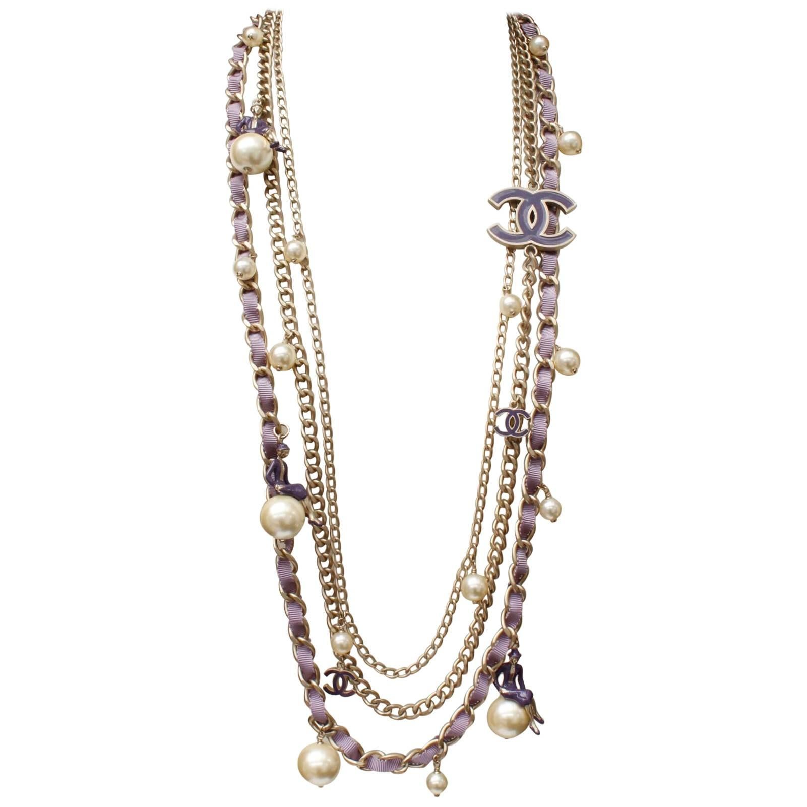 Chanel “Coco sur le monde” multistrand sautoir in silver tone and purple, 2004 