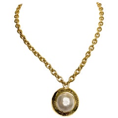 Vintage CHANEL golden chain necklace with round faux pearl and logo pendant top.