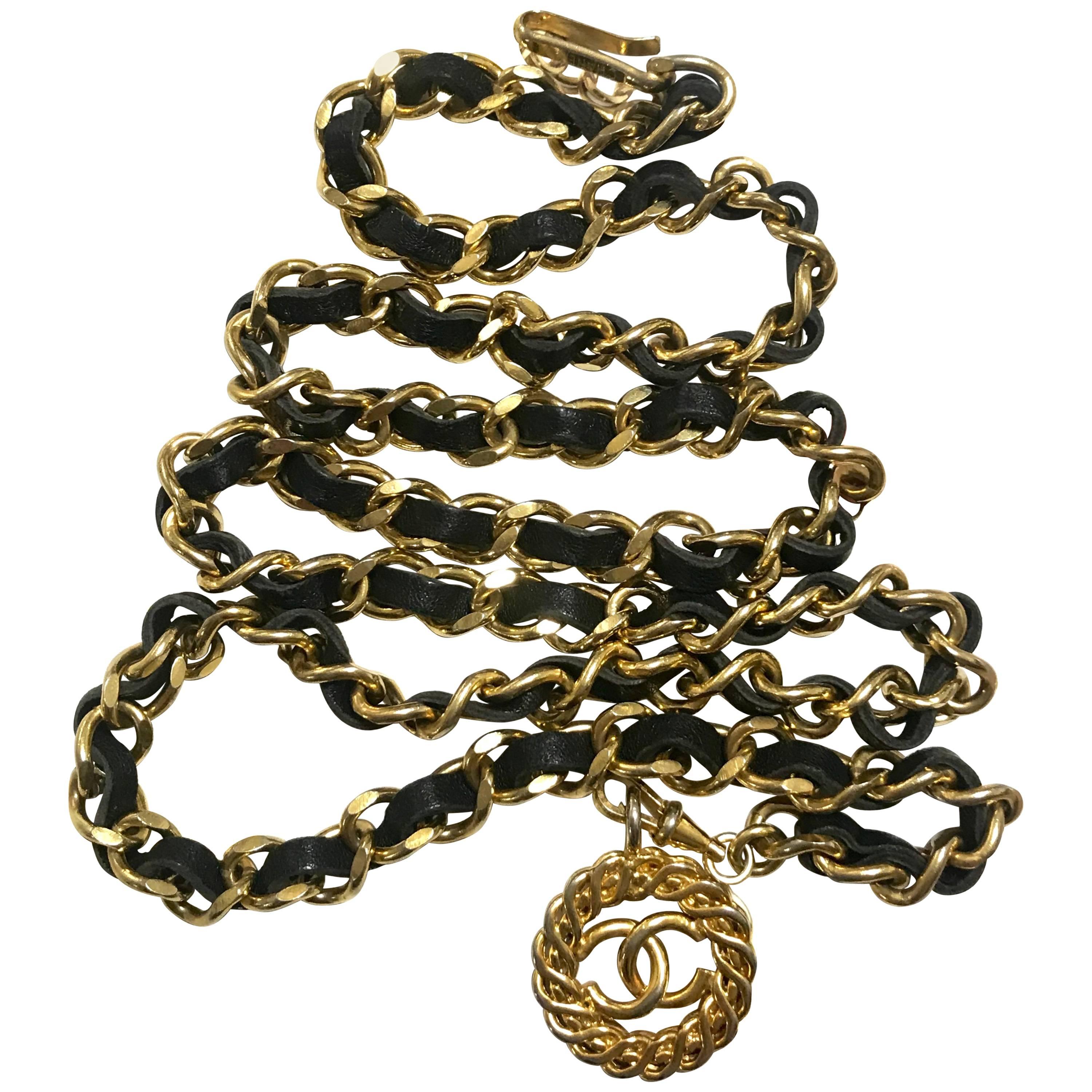 Vintage CHANEL golden chain and black belt/necklace with flower CC mark charm. 