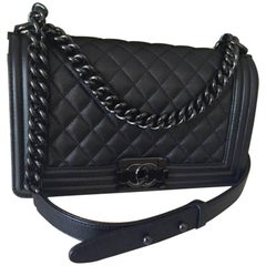 Chanel Medium SO black Boy Bag in quilted Caviar Leather .