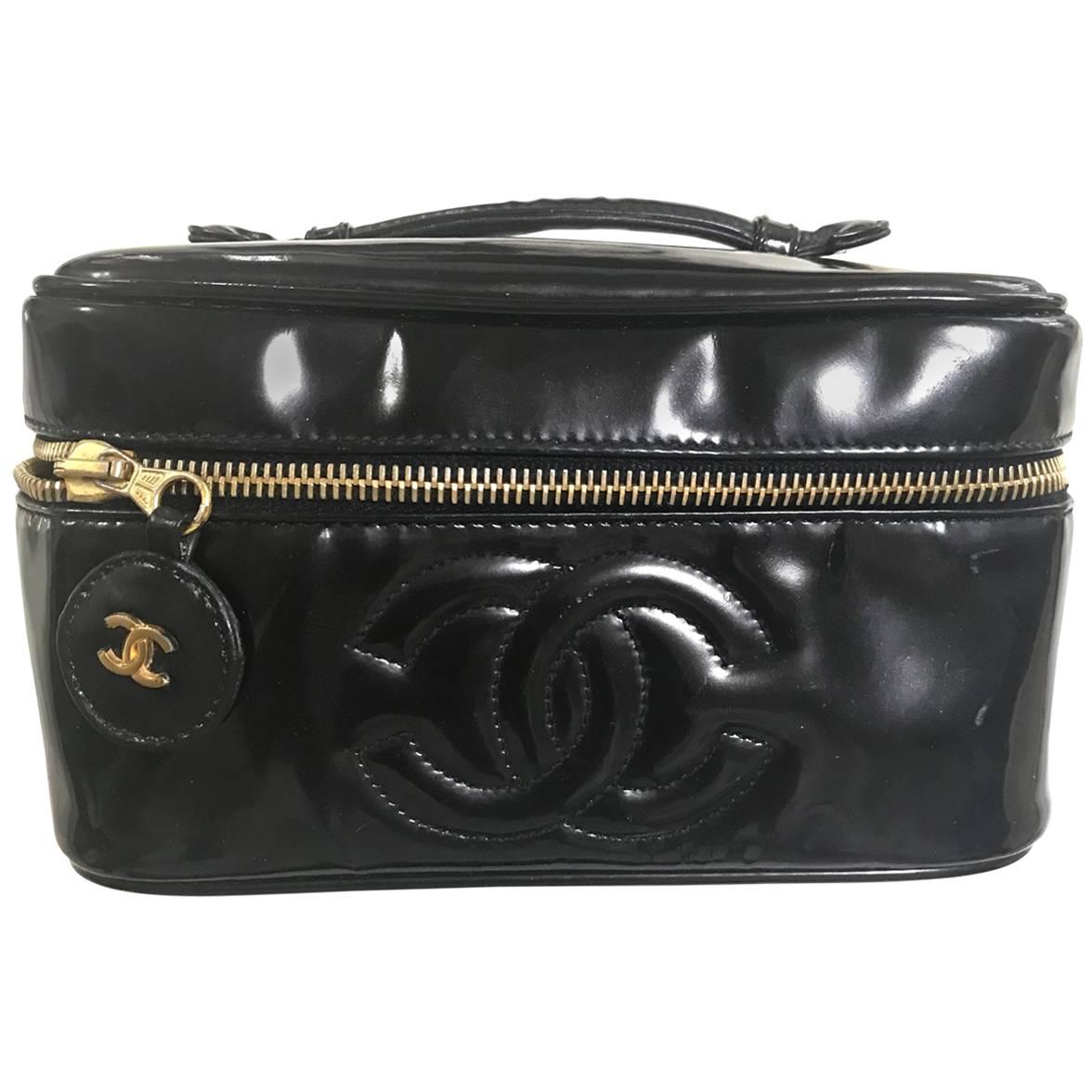 Chanel Vintage patent enamel cosmetic and toiletry black pouch purse with CC. For Sale