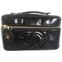 Chanel Vintage patent enamel cosmetic and toiletry black pouch purse with CC.