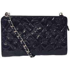 Chanel Black Patent Shoulder Bag Embossed With Signature Trademarks and Icons 