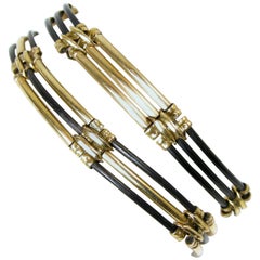 Two Art Deco Gold Tone and Onyx Rod Bracelets