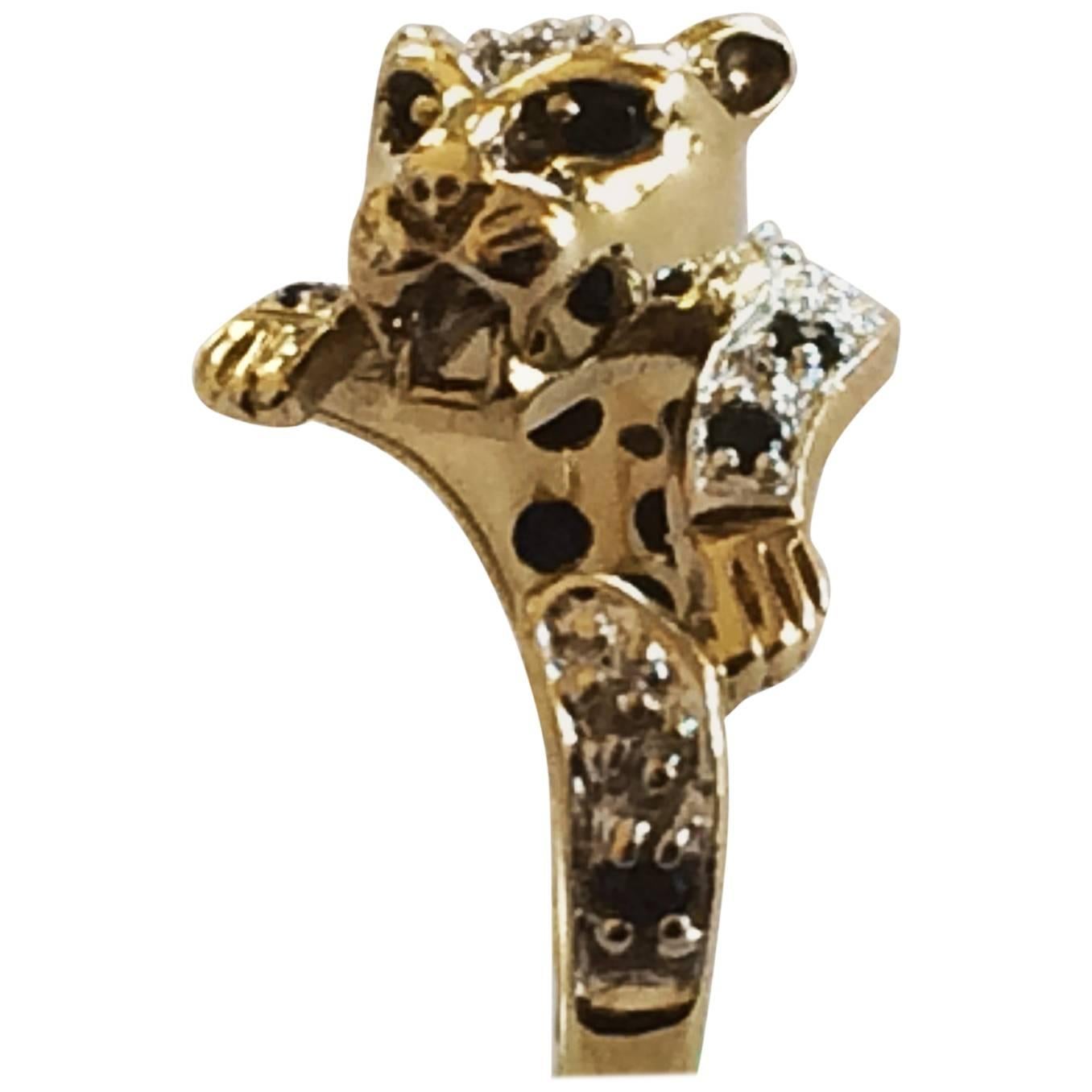 Mid Century Leopard ring in gold, sapphires and diamond