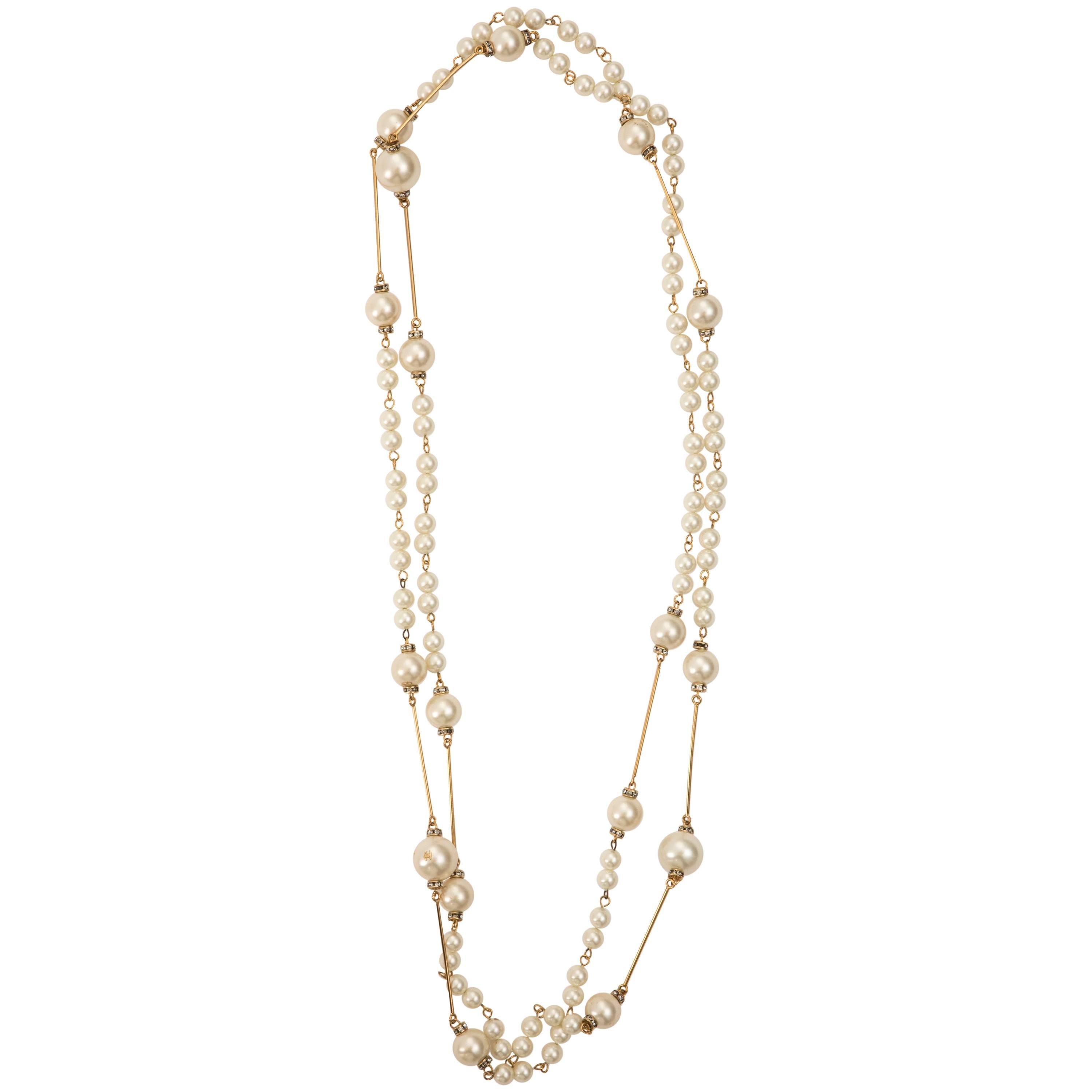  Chanel, Spring 2001 faux pearl sautoir with crystal stations. 

Chain Length 70”