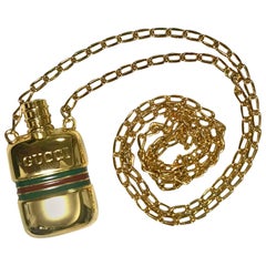 MINT. Retro Gucci golden mini perfume, eau de cologne bottle necklace.