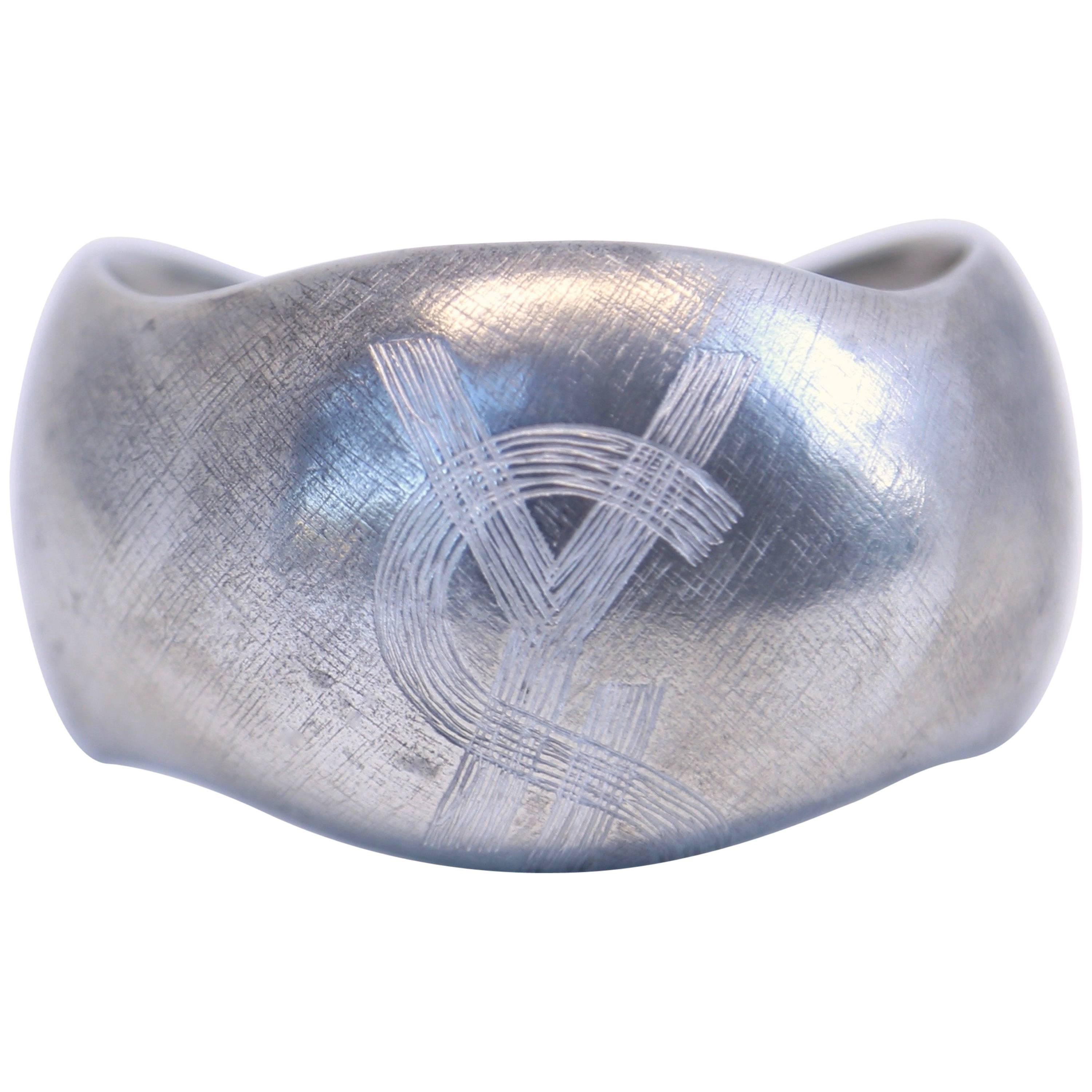 1985 YVES SAINT LAURENT silver toned logo cuff