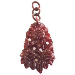 Antique Art Deco Cherry amber red bakelite heavily carved necklace pendant