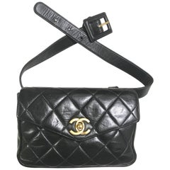 Chanel Vintage black leather waist purse and/or fanny bag with belt and CC motif