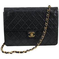 Vinatge Chanel Black Leather Shoulder Bag. New Clasp and chain