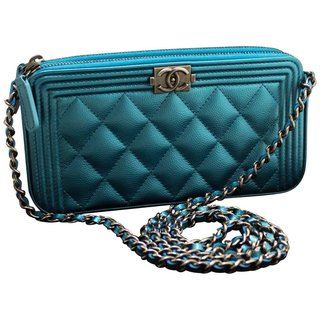 metallic blue clutch bag