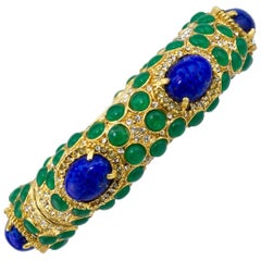 1970s Kenneth Jay Lane Gold Tone Bangle with Green and Blue Cabochon Stones 