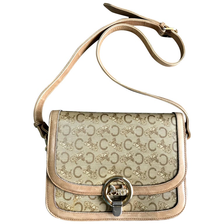Vintage Celine beige macadam and blason pattern shoulder bag with golden motif. For Sale at 1stDibs