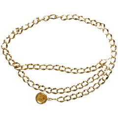 Chanel Vintage golden thick chain belt with a round CC charm, 1980s 