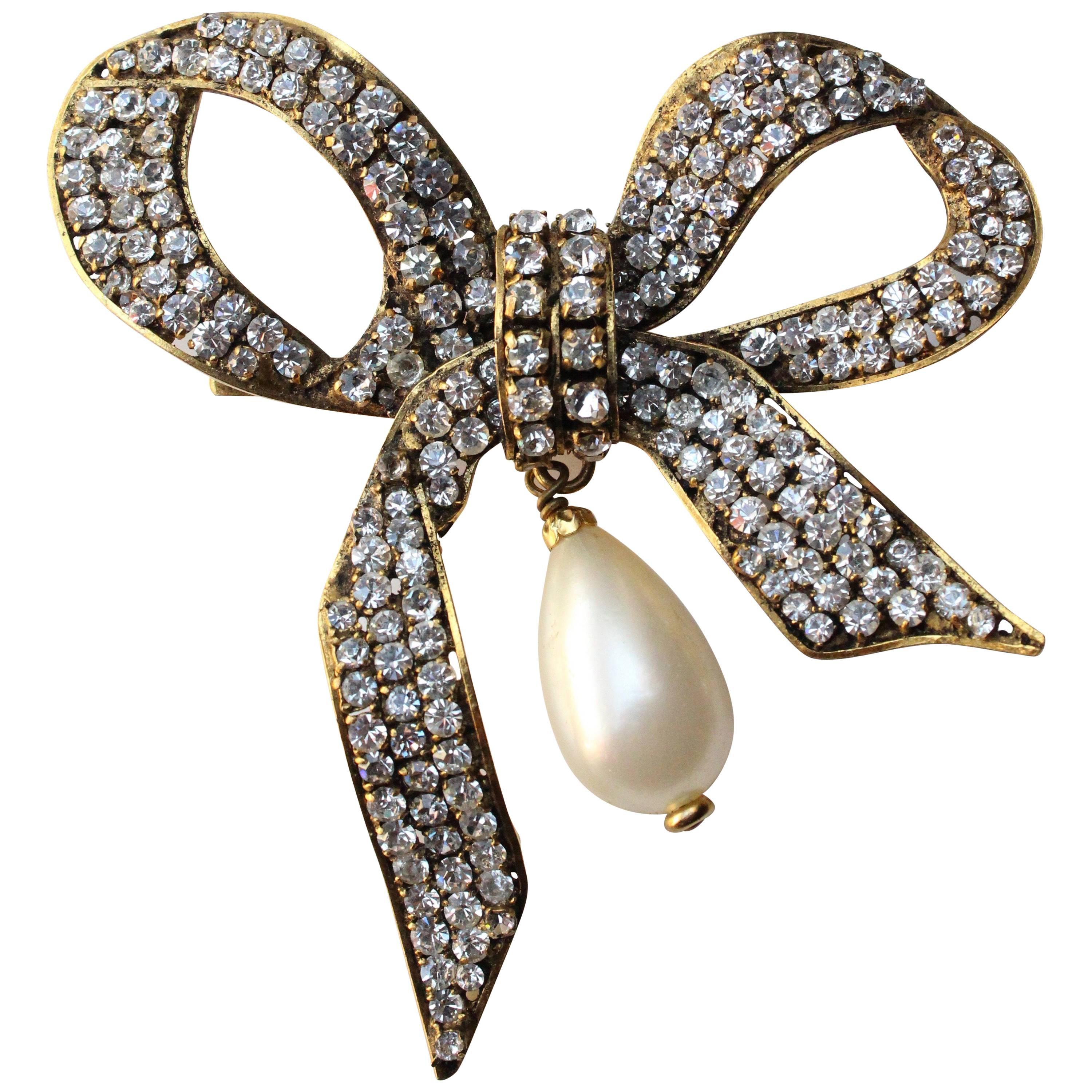 Chanel bow brooch with pearly tear drop, 1980s  For Sale