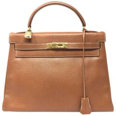 1992, HERMES Vintage Sac Kelly 32 bag in Courchevel Gold Leather.