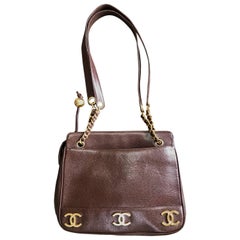 Vintage CHANEL brown caviar leather chain shoulder bag with 3 golden CC marks.
