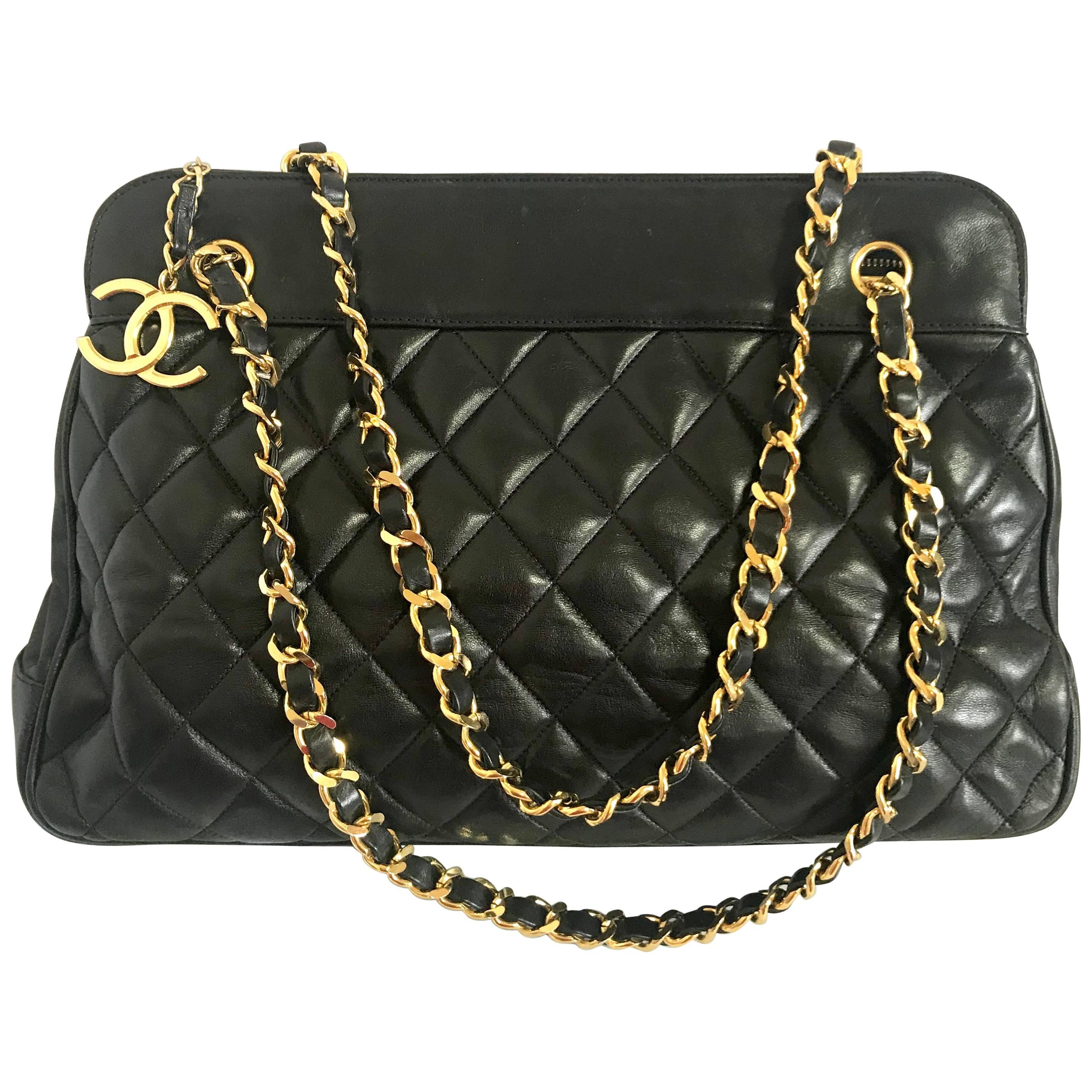 Vintage CHANEL black lambskin large tote bag with gold tone chains and jumbo CC. For Sale