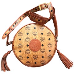 Vintage MCM brown Suzy Wong round shoulder bag with fringes. Michael Cromer.