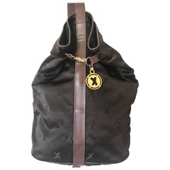 Vintage Paloma Picasso brown satin logo jacquard hobo style shoulder bag.