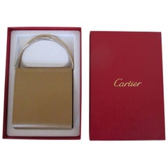 Portefeuille en cuir beige Cartier trinity