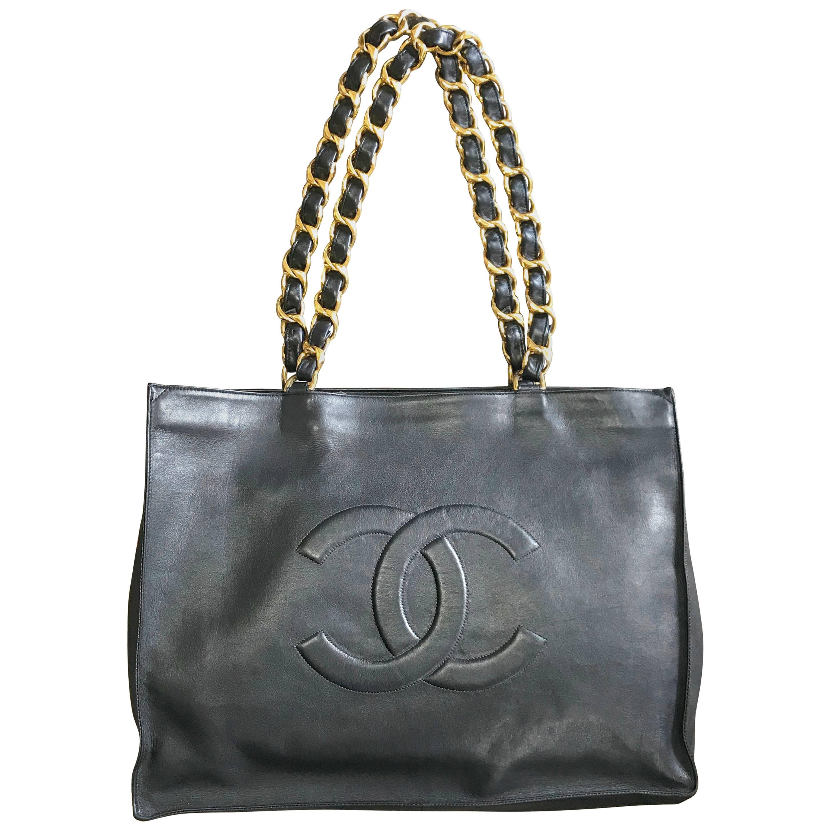 Chanel Vintage black calfskin large tote bag with gold tone chain handles and CC