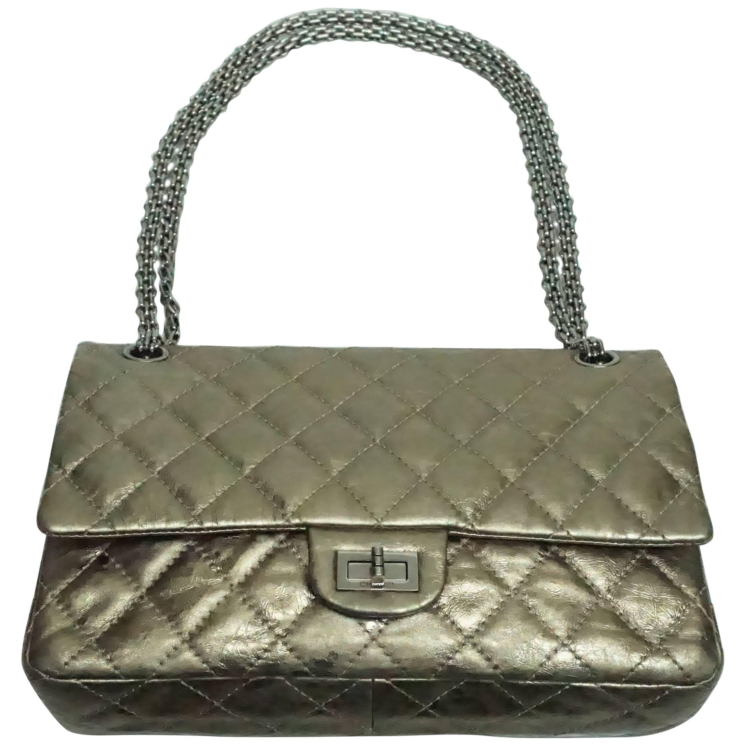 Chanel Bronze Metallic Lambskin 2.55 Double Flap - SHW - 226 size This beautiful reissue bag has the mademoiselle lock and chain in SHW. It is a spectacular metallic bronze lambskin. The bag is in very good condition. Circa 2006/2007.
 Measurements: