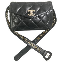 Chanel Vintage black lamb waist bag fanny pack with golden chain belt and CC 