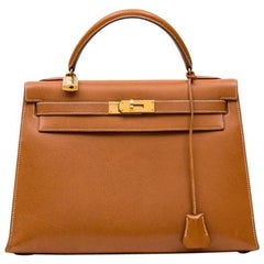 A WHITE EPSOM LEATHER SELLIER KELLY 32 WITH GOLD HARDWARE, HERMÈS