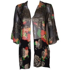 A Vintage 1980s lurex floral evening jacket by Caroline Charles