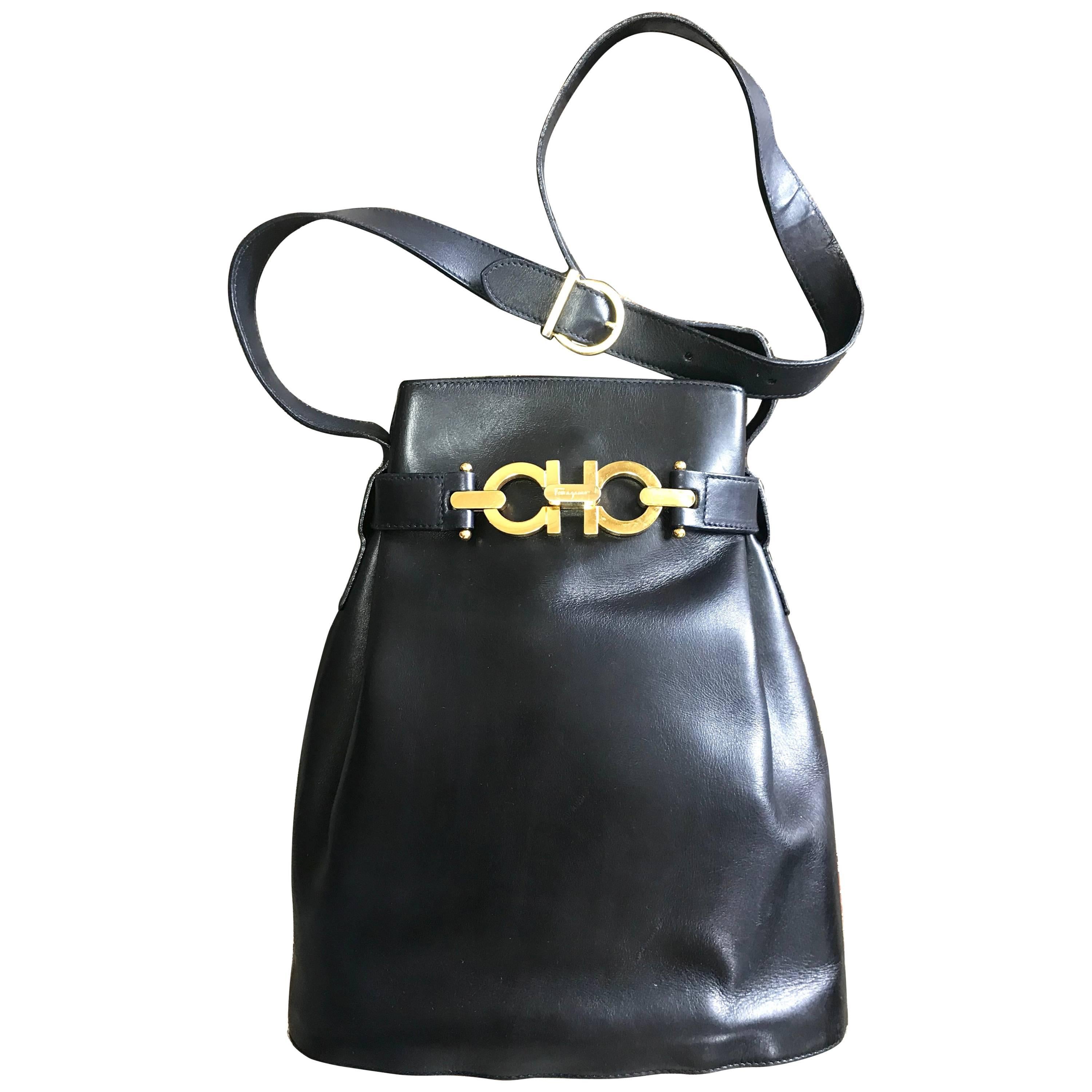Vintage Salvatore Ferragamo navy leather hobo shoulder bag with gancini motif. For Sale
